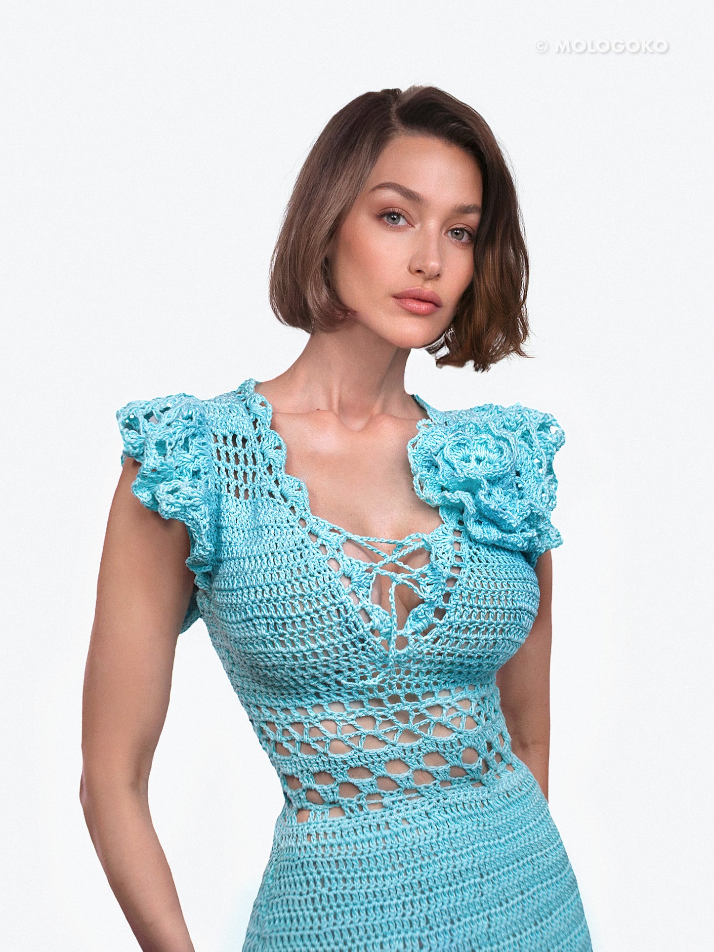 Blossom Crochet Maxi Dress in turquoise blue with intricate lace pattern, ruffle sleeves and lace-up front detail