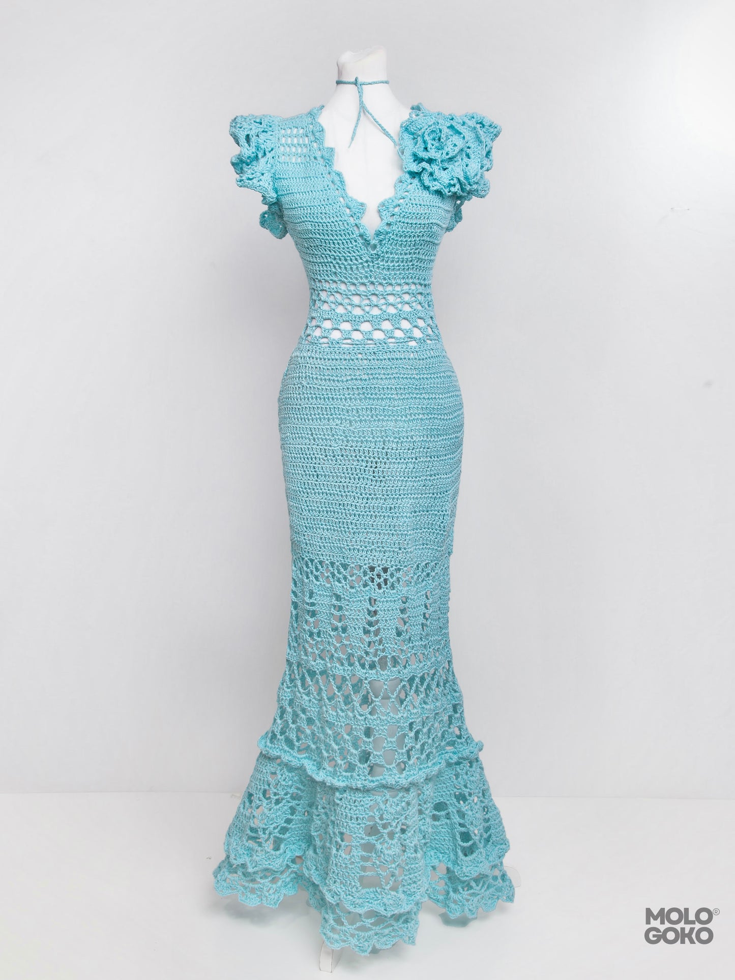 Blossom Crochet Maxi Dress in turquoise blue with ruffled sleeves, V-neck, and intricate lace pattern displayed on mannequin