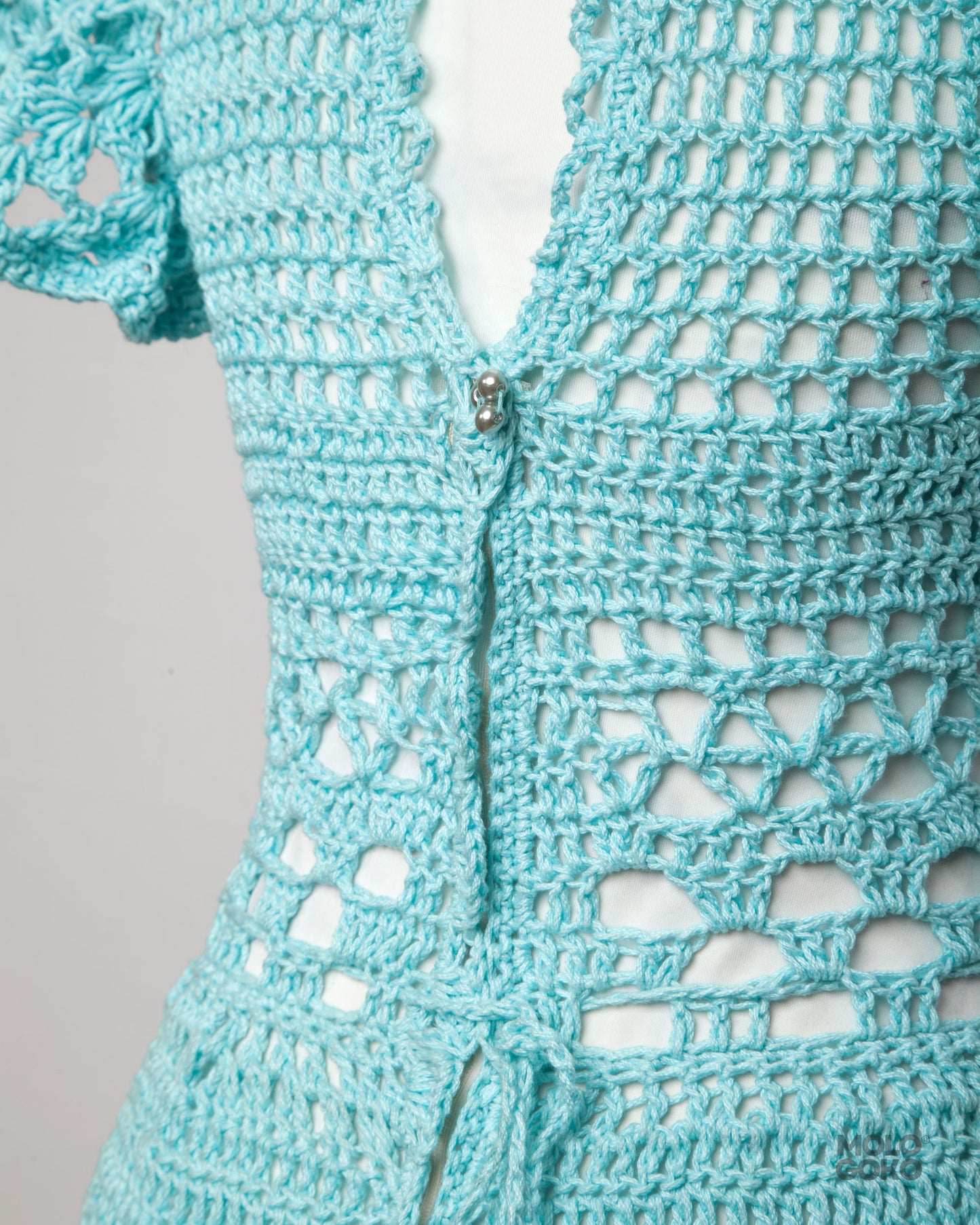 Blossom Crochet Maxi Dress in turquoise cotton yarn featuring intricate lace pattern and fitted waist with back zipper detail