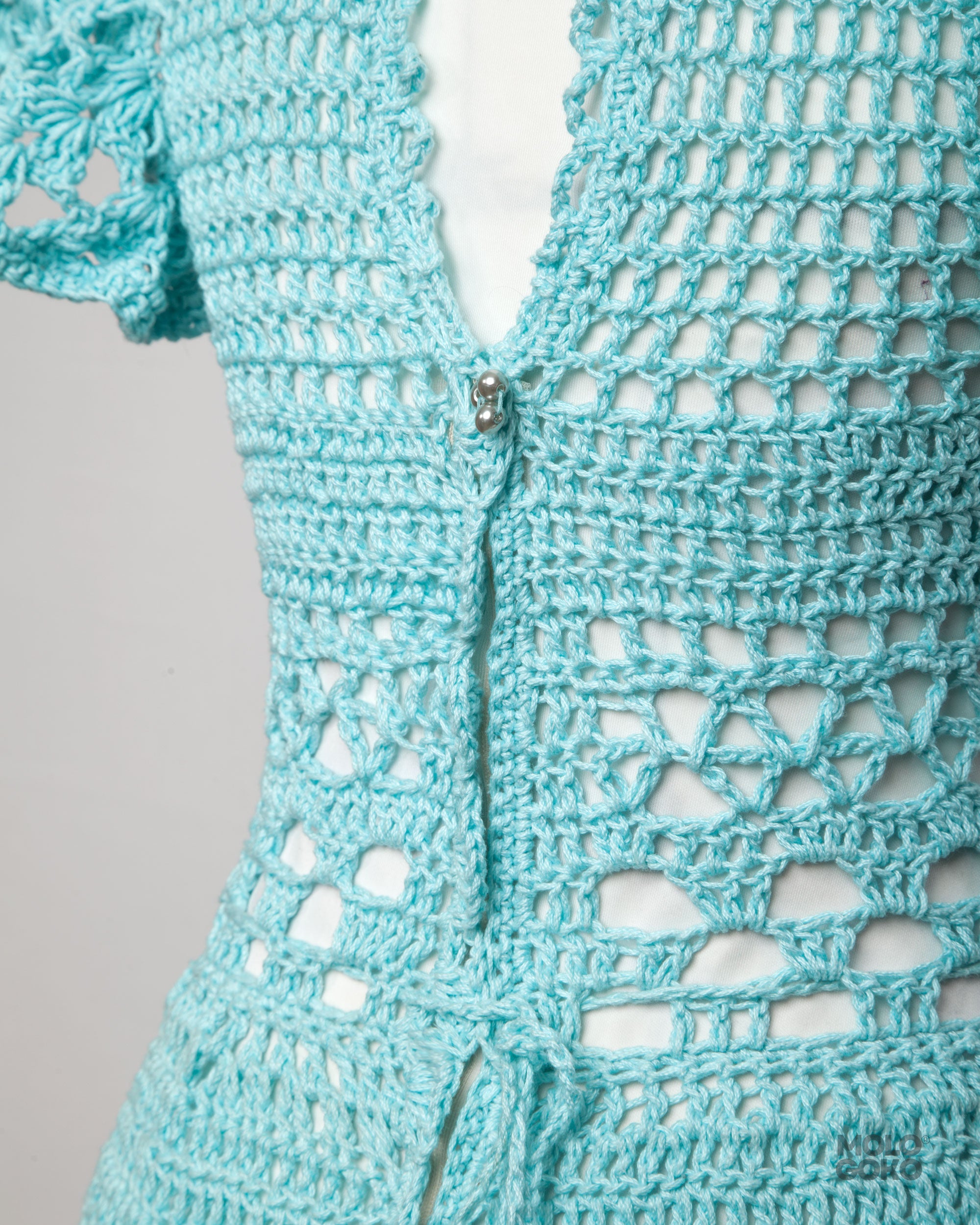 Blossom Crochet Maxi Dress in turquoise cotton yarn featuring intricate lace pattern and fitted waist with back zipper detail
