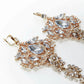 Amily Extra Large Dangle Statement Earrings in rose gold with clear crystals and ornate chandelier design