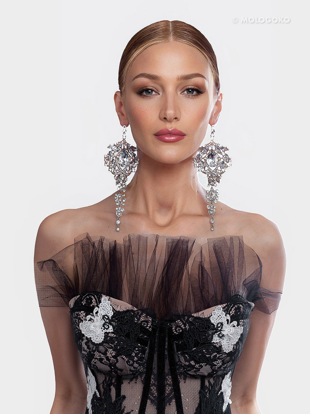 Amily Extra Large Dangle Statement Earrings shown with dramatic crystal cascading design in silver, 8 inches long