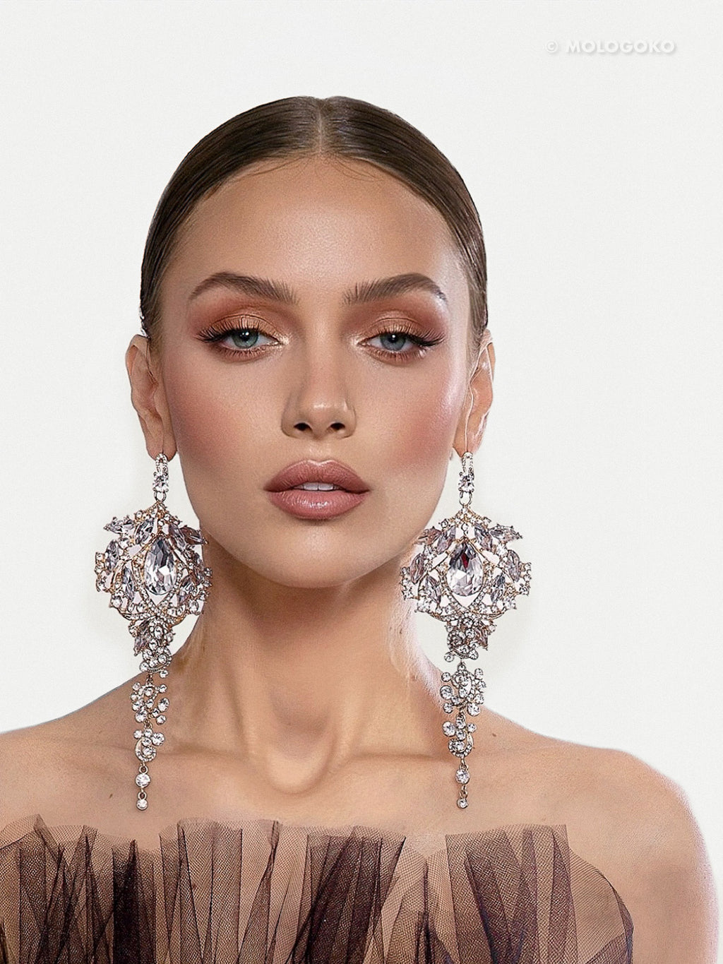 Amily Extra Large Dangle Statement Earrings showcased on elegant model wearing crystal chandelier design with cascading details