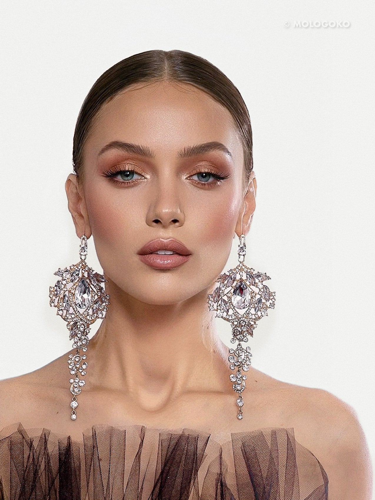 Amily Extra Large Dangle Statement Earrings showcased on elegant model wearing crystal chandelier design with cascading details