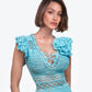 Blossom Crochet Maxi Dress in turquoise blue with intricate lace pattern, ruffle sleeves and lace-up front detail