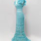 Blossom Crochet Maxi Dress in turquoise with handmade lace pattern, ruffled sleeves and floor-length design on mannequin
