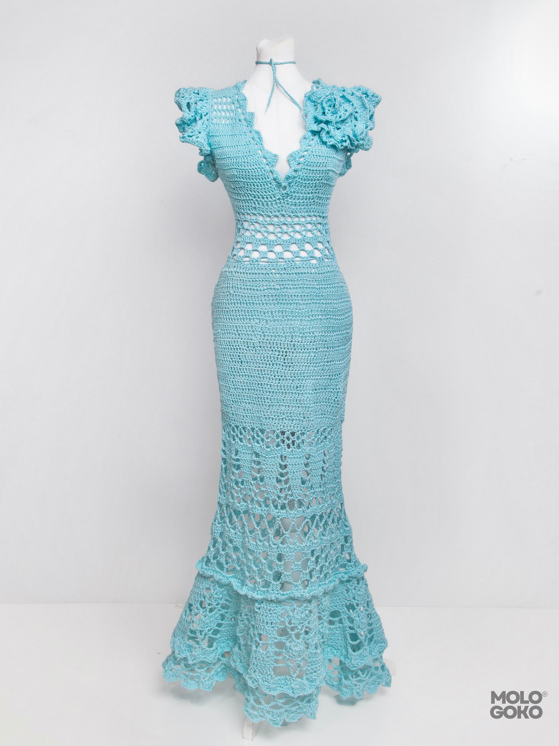 Blossom Crochet Maxi Dress in turquoise blue with ruffled sleeves, V-neck, and intricate lace pattern displayed on mannequin
