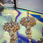 Amily Extra Large Dangle Statement Earrings in gold with crystal rhinestones and glass beads, showcasing ornate chandelier design