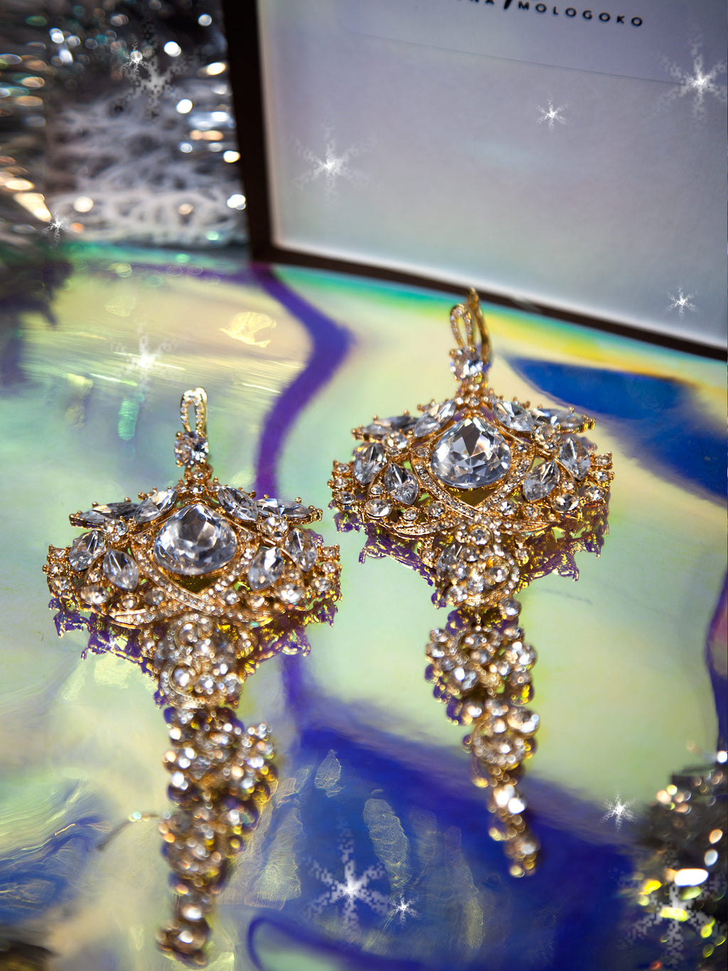 Amily Extra Large Dangle Statement Earrings in gold with crystal rhinestones and glass beads, showcasing ornate chandelier design