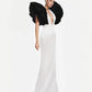 Monique Gown in white with dramatic black ruffled shoulders and plunging neckline, elegant floor-length silhouette