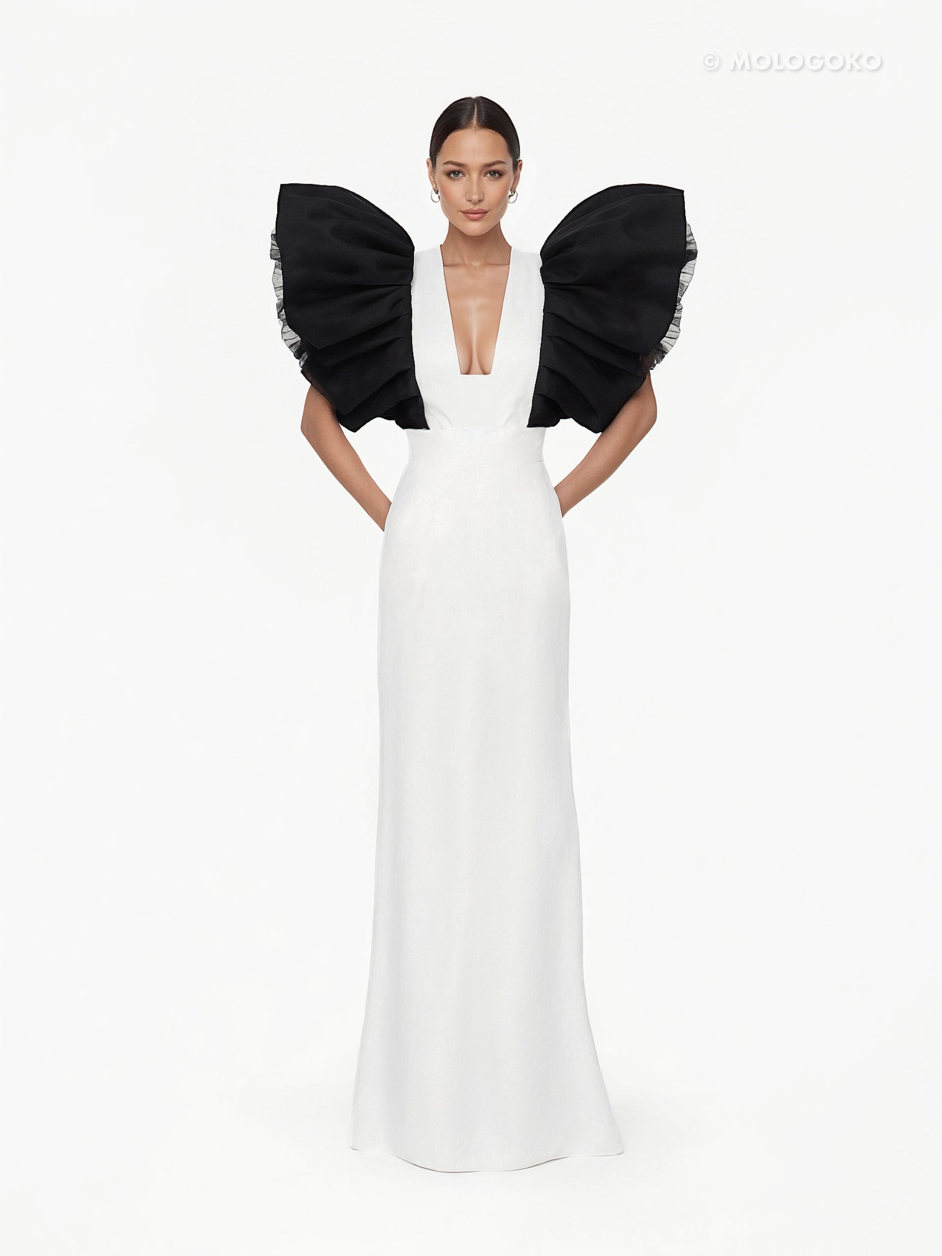 Black and White Monique Gown featuring dramatic black ruffled sleeves and plunging neckline on white floor-length dress